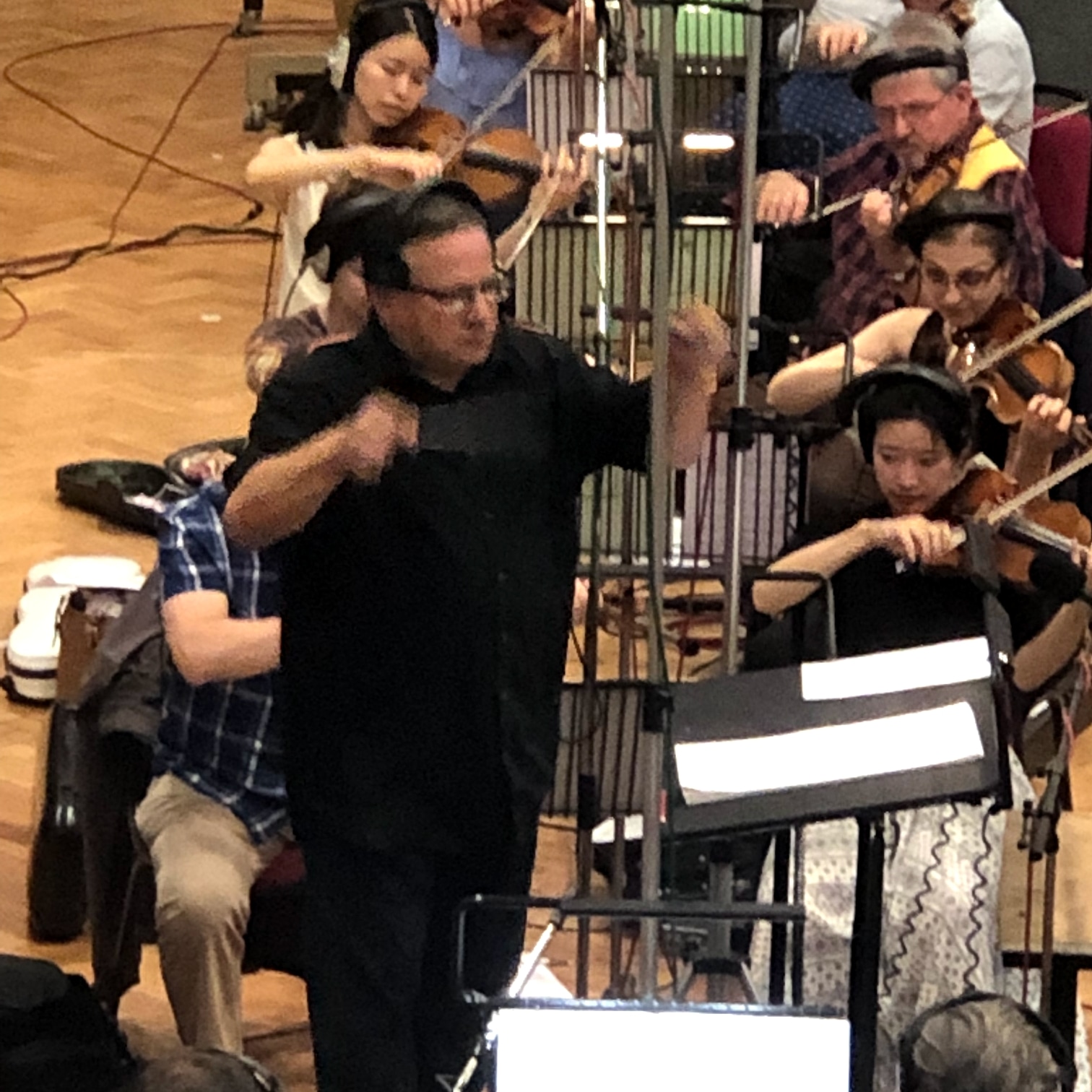 Close view of Bob Marino conducting orchestra
